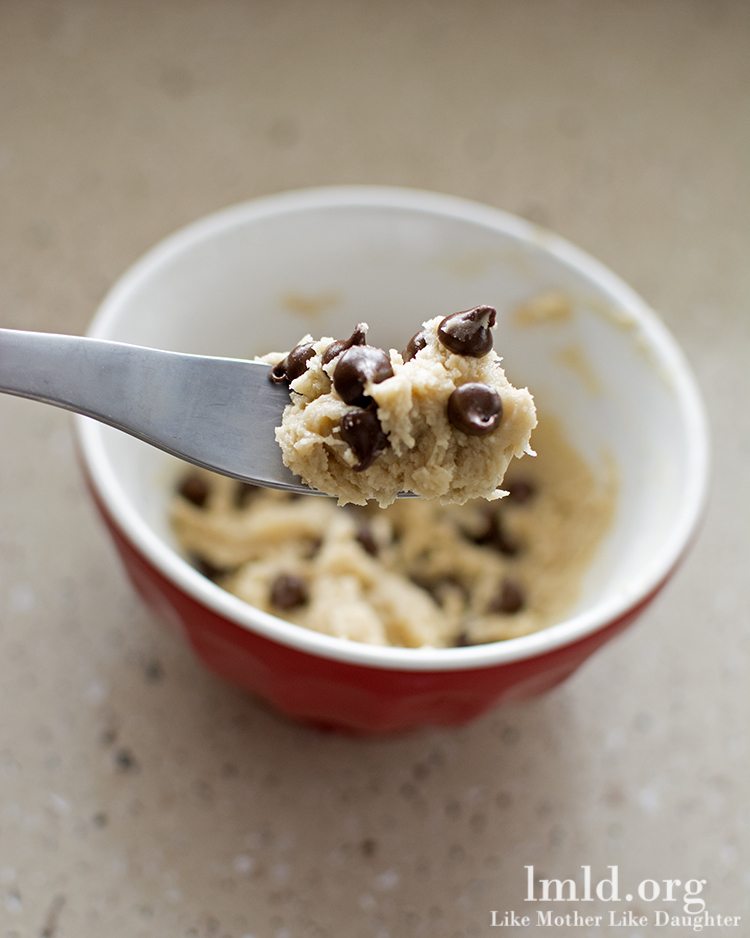Close up of forkful of chocolate chip cookie dough.