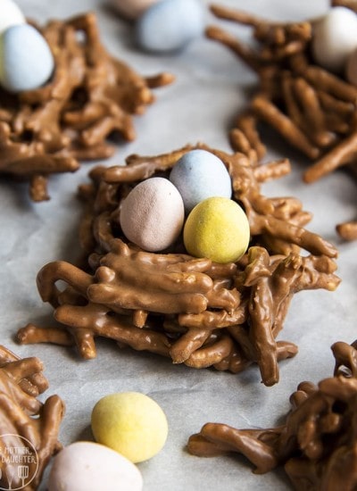 Birds nests made from chow mein noodles coated in chocolate and stuffed with three candy eggs.