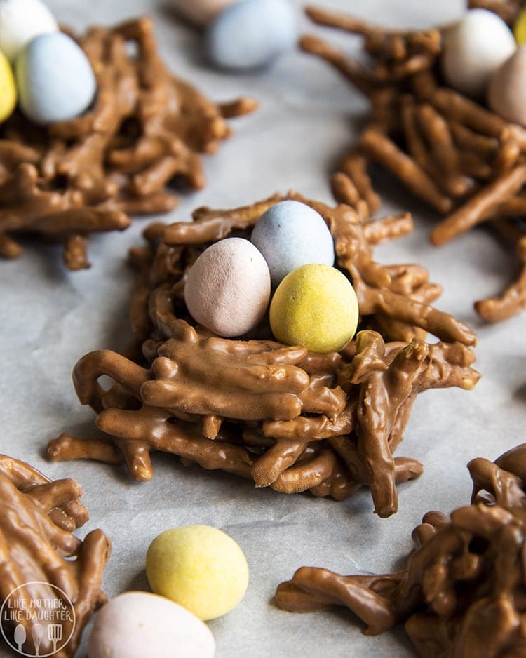 Birds nests made from chow mein noodles coated in chocolate and stuffed with three candy eggs.