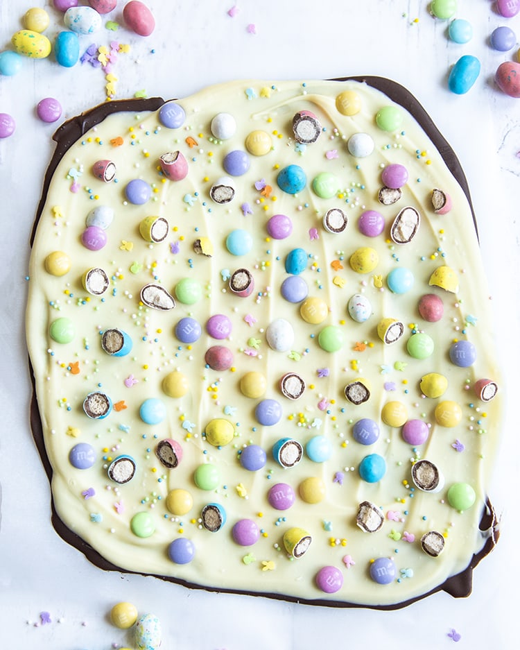 A big slab of chocolate bark, with chocolate underneath, white chocolate on top, and it's loaded with Easter sprinkles, pastel colored m&ms, and chopped up robin egg candies.