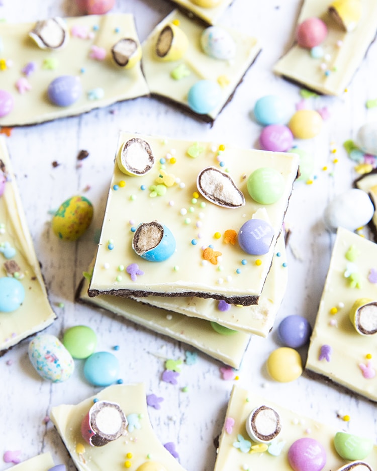 A stack of Easter bark from above, with layers of chocolate, white chocolate, and topped with Easter candies.