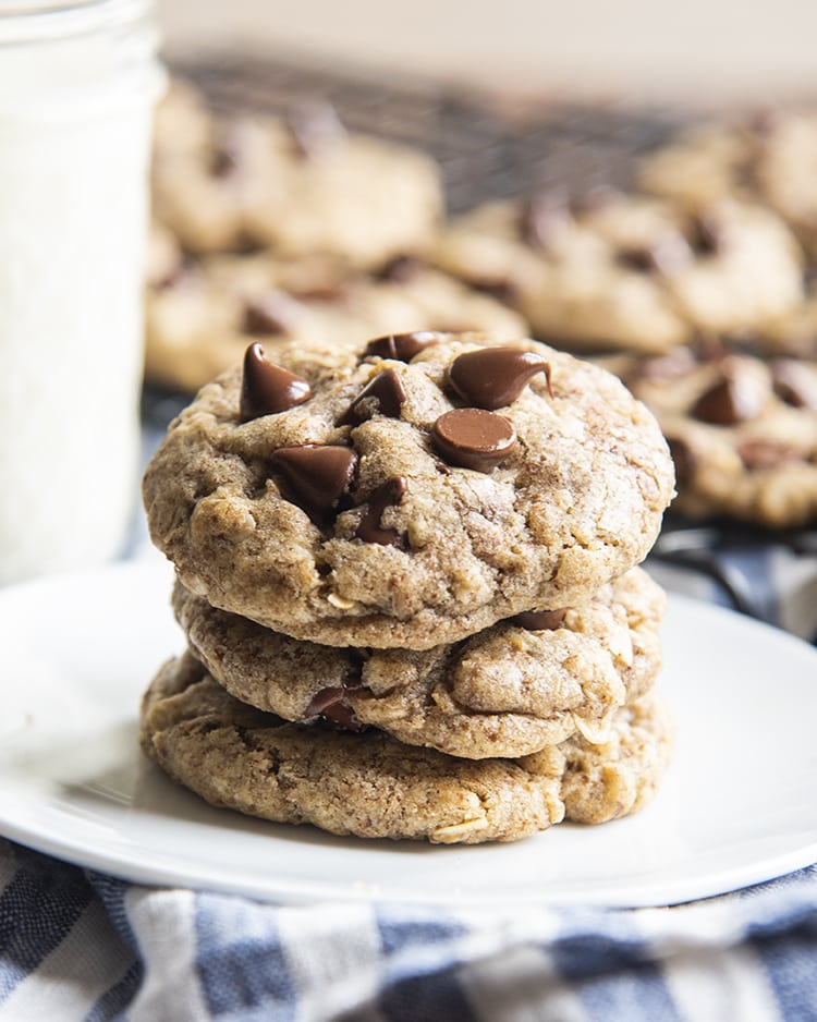 A close up of soft and chewy oatmeal flax chocolate chip cookies on a plate.