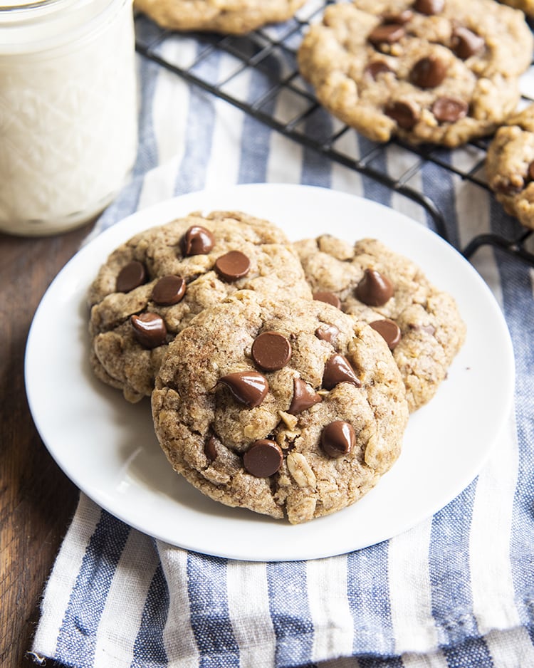 A close up of soft and chewy oatmeal flax chocolate chip cookies on a plate.