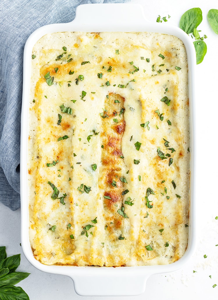 A pan of white chocolate lasagna topped with parsley