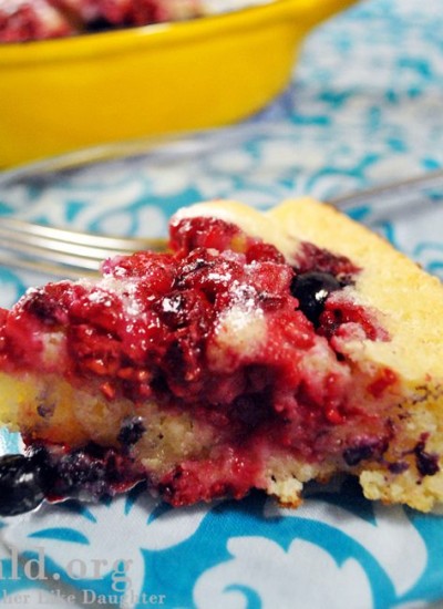 Angled view of oven baked pancake with berries.