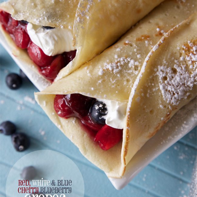 Top view of cherry blueberry breakfast crepes.