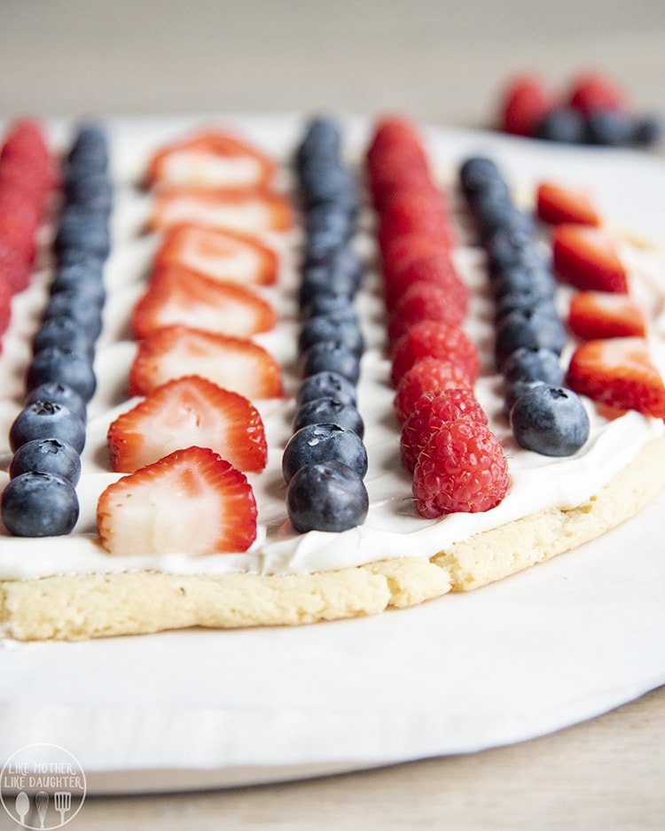 Patriotic Fruit pizza topped with blueberries, strawberries, and raspberries