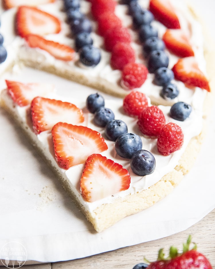 Fruit pizza topped with blueberries, strawberries, and raspberries