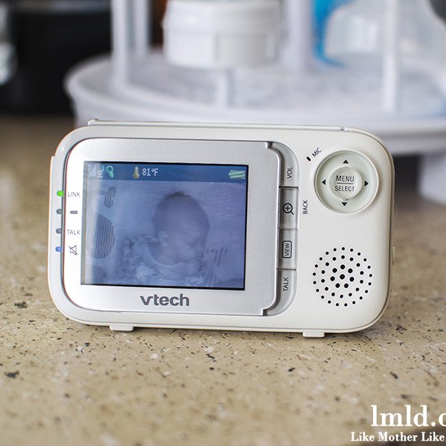 Front view of a vtech baby monitor with video displayed.