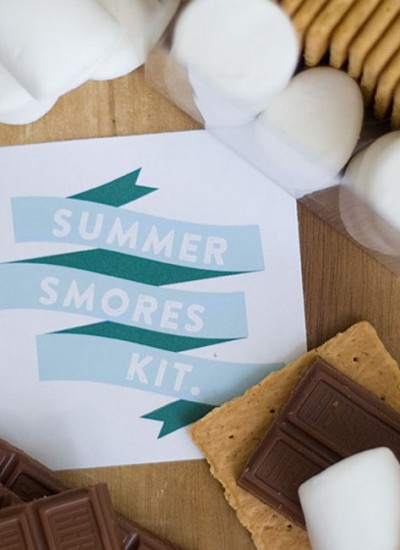 Summer smores kit text with all the ingredients for smores in a box.