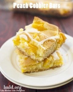 Front view of peach cobbler on a white plate.