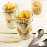 Front view of tropical dole fruit parfaits in mason jars.