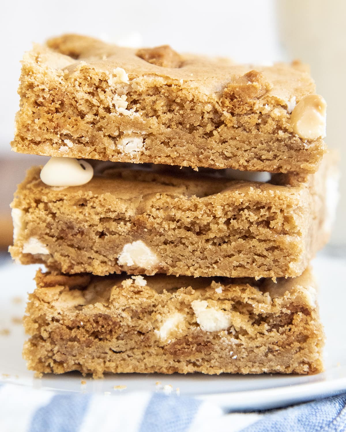 A close up of a stack of 3 cookie bars.