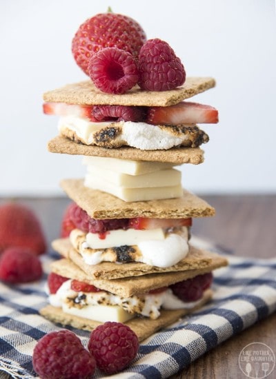 Front view of berries and cream smores stacked on top of each other.