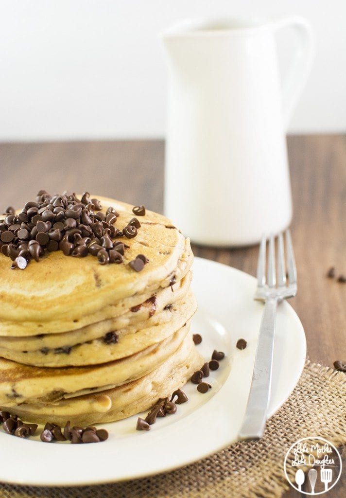 Angled view of peanut butter chocolate chip pancakes with chocolate chips on top.