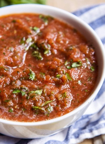A close up of a bowl of restaurant style salsa.