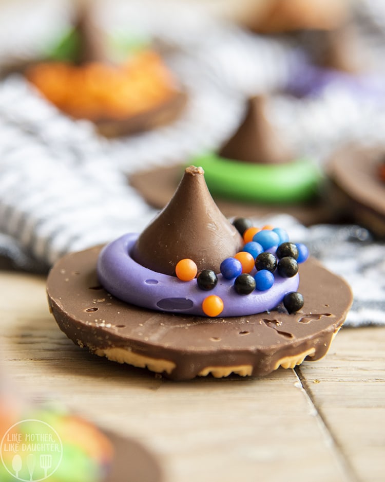 Fudge Stripe Cookies decorated with a hershey kiss to make witch hat cookies