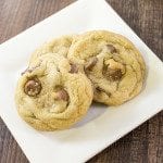 Top view of chocolate chip cookies on a white plate.