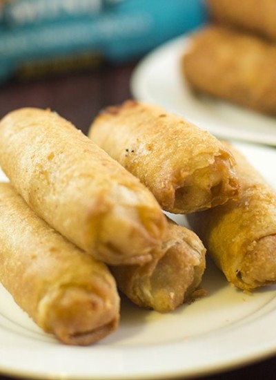 Front view of authentic tai pei egg rolls on a white plate.