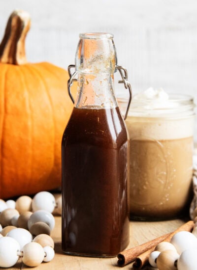 A glass bottle of homemade pumpkin spice syrup.