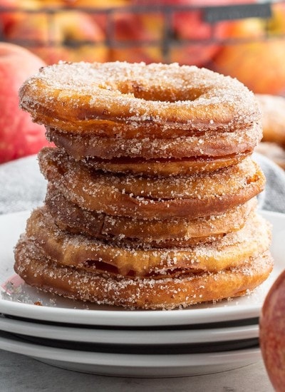 A stack of fried apple rings on a plate.