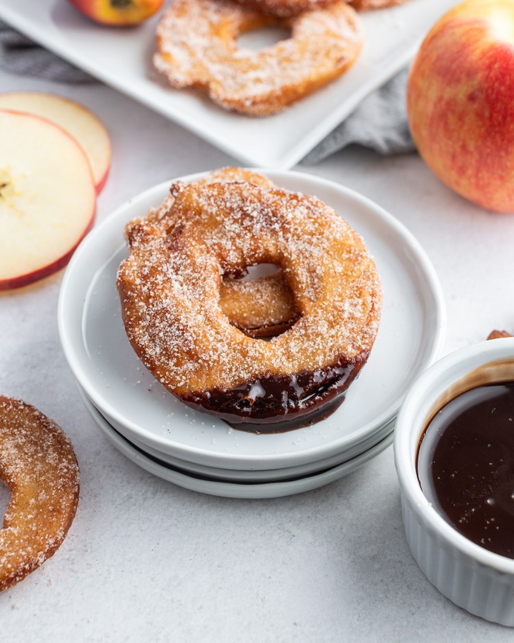 Fried apple rings coated in cinnamon sugar and dipped in chocolate.