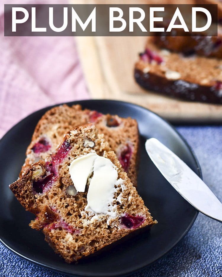 A slice of plum bread on a plate with butter spread on it, with text overlay for pinterest.