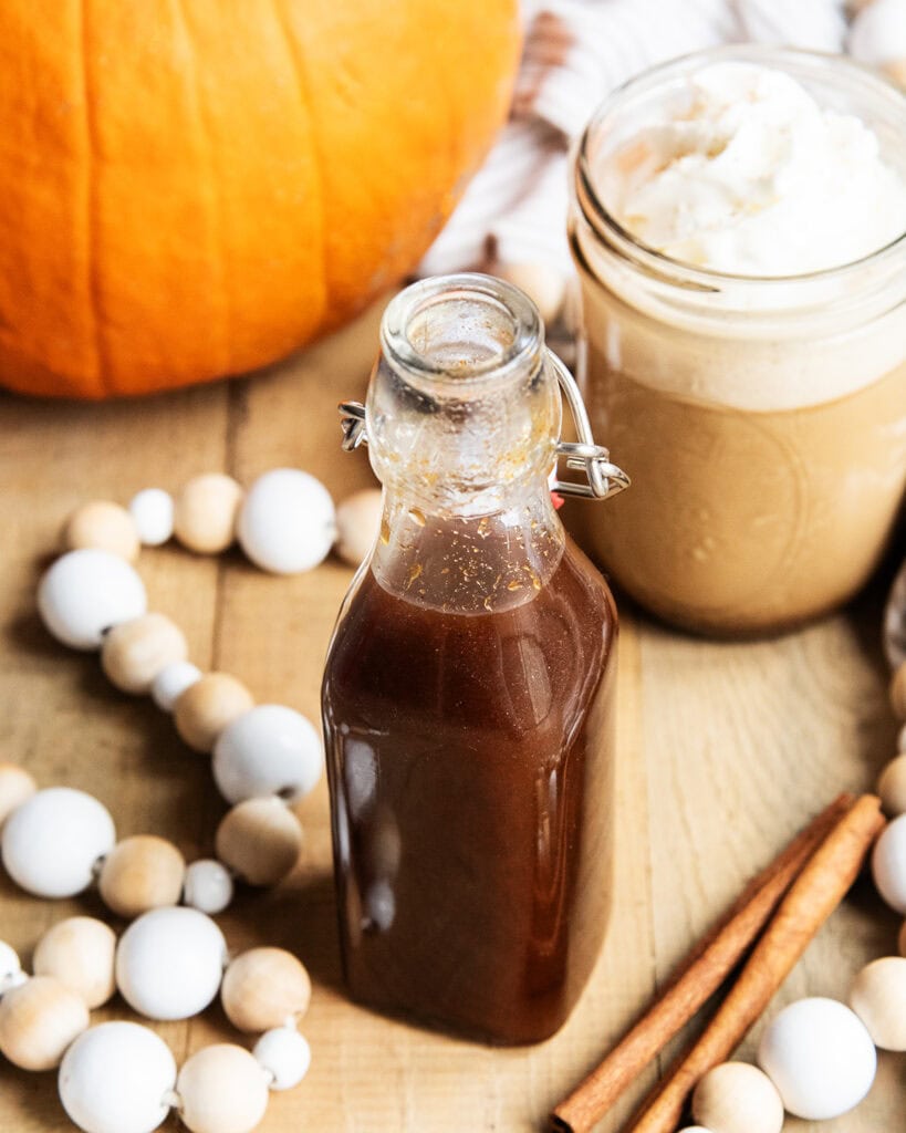 A glass bottle of homemade pumpkin spice syrup.