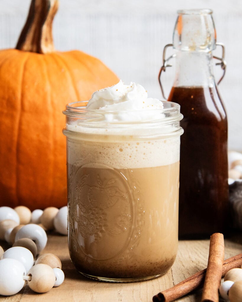 A homemade pumpkin latte topped with whipped cream.