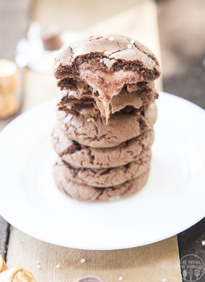 Front view of a rolo cookies with sea salt on a white plate.