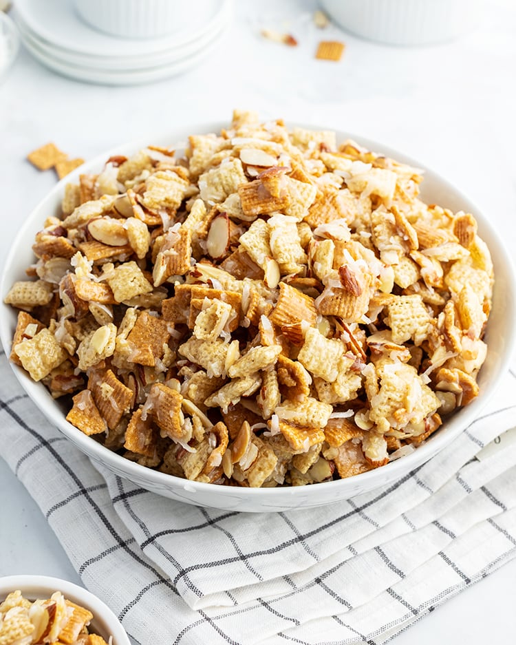 A bowl of gooey coconut holiday chex mix.