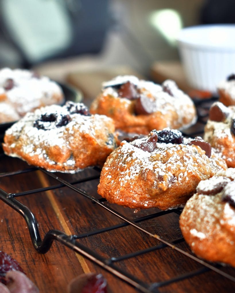 Close up view of persimmon chocolate chip cookies on a cooling rack.