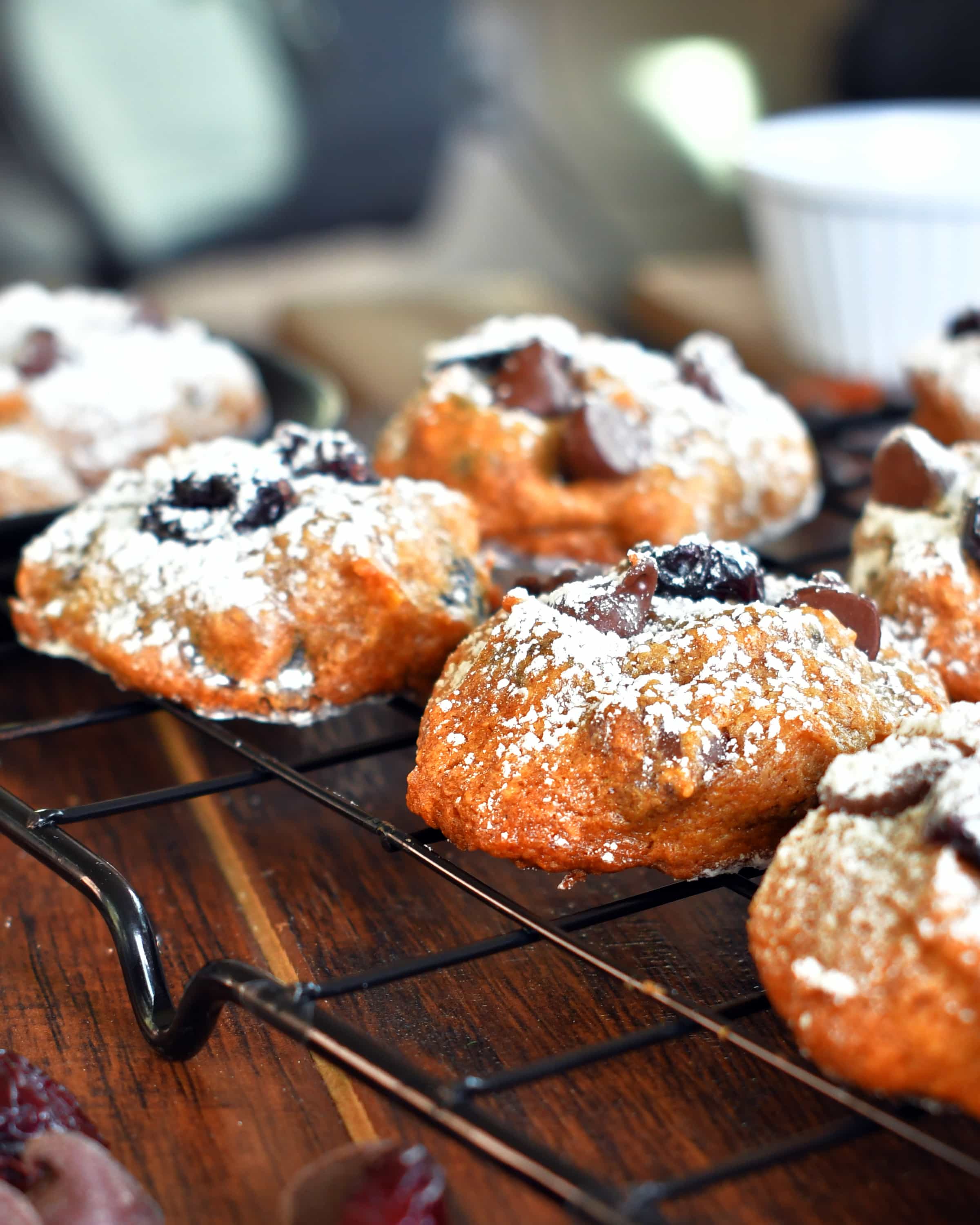 Close up view of persimmon chocolate chip cookies on a cooling rack.