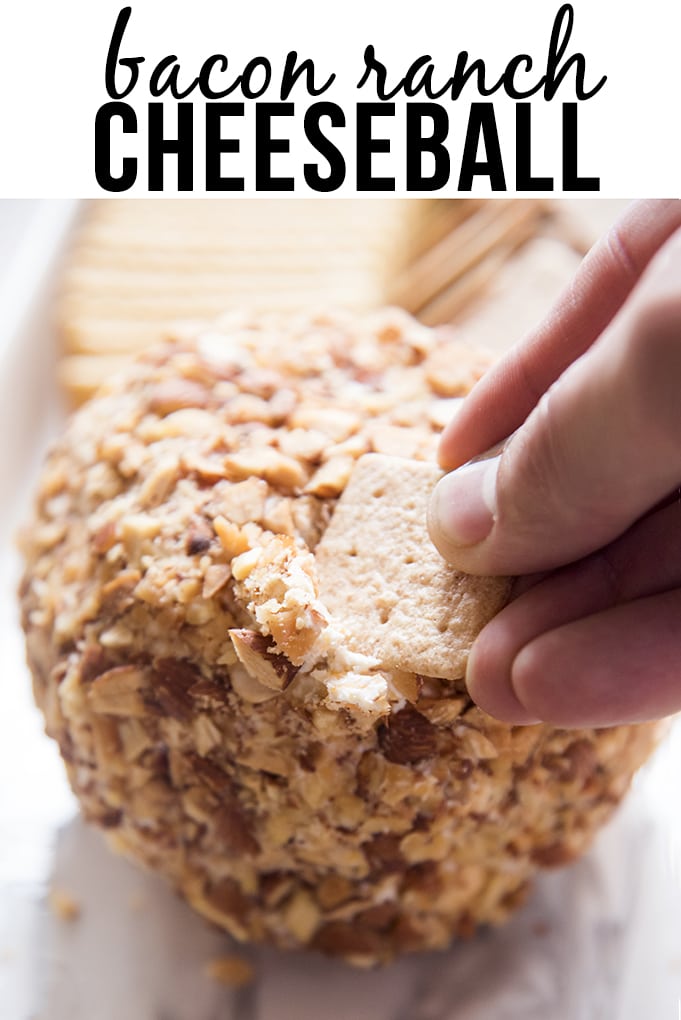 A cheeseball covered in nuts with a text block over the top. 