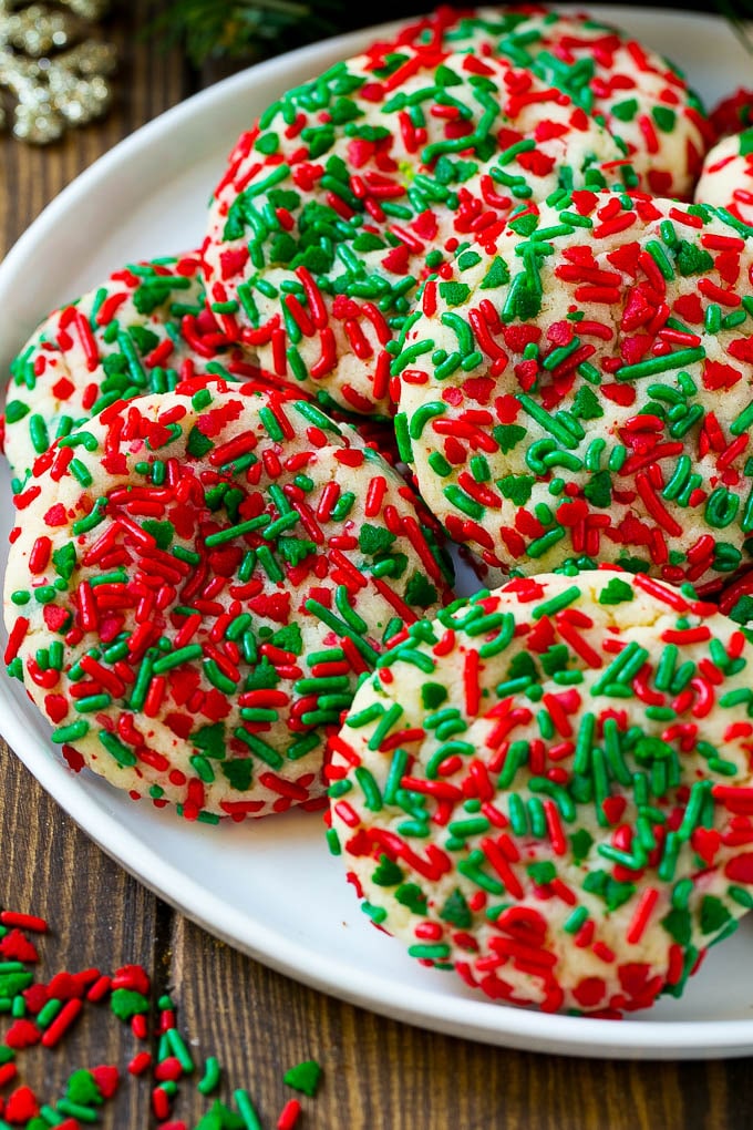 A plate of Christmas cookies covered all over in red and green sprinkles.