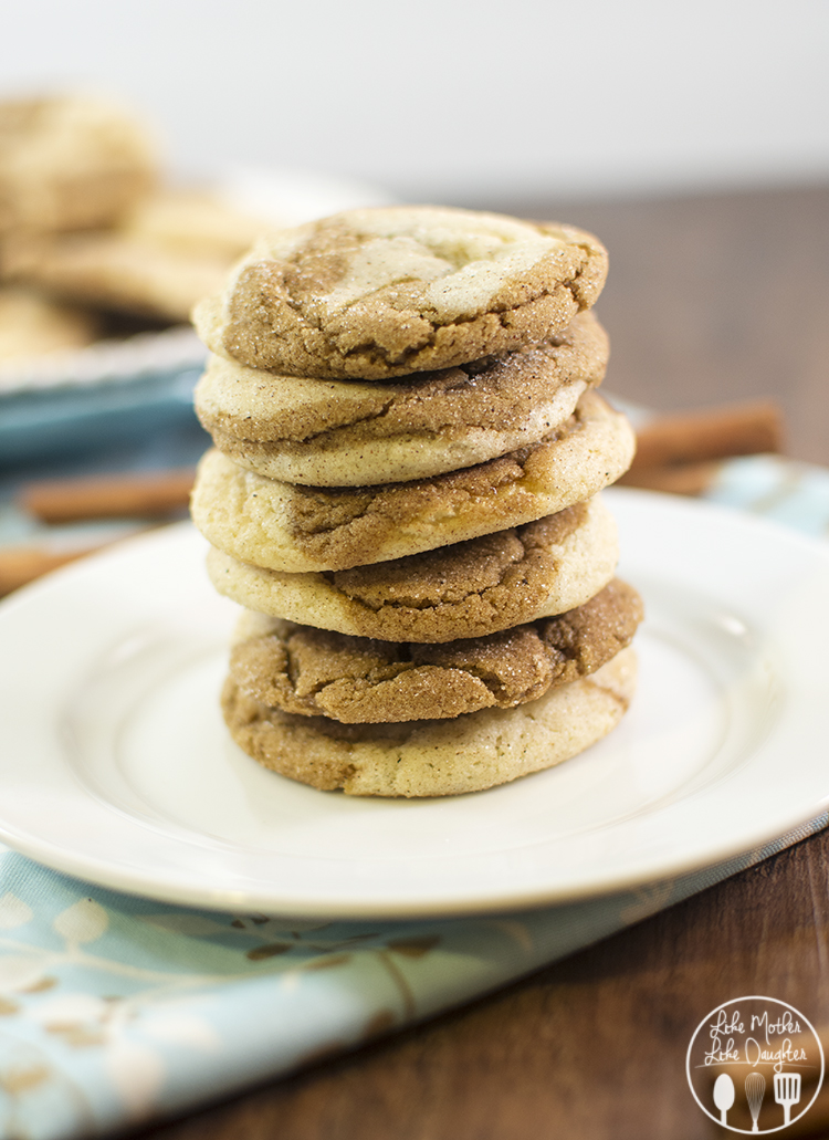 Side view of a stack of gingerdoodles on a white plate.