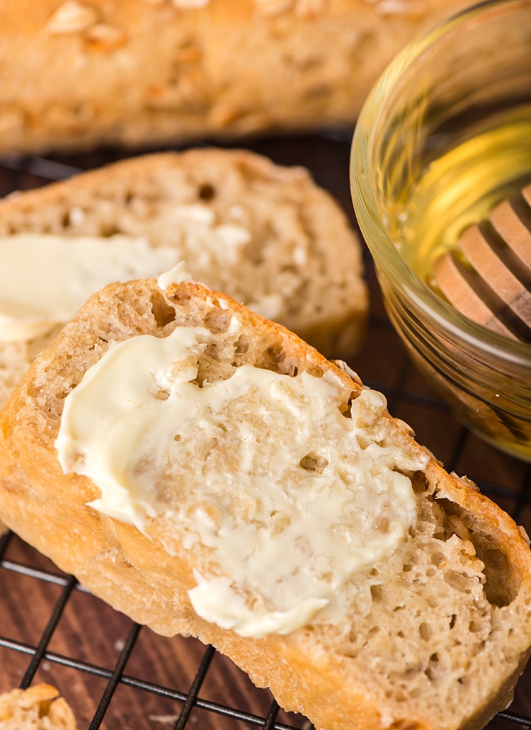 A slice of oat bread with butter