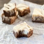 Angled view of swirled fudge on parchment paper.