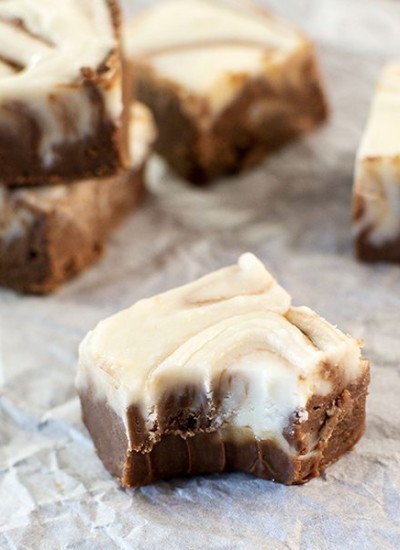 Angled view of swirled fudge on parchment paper.