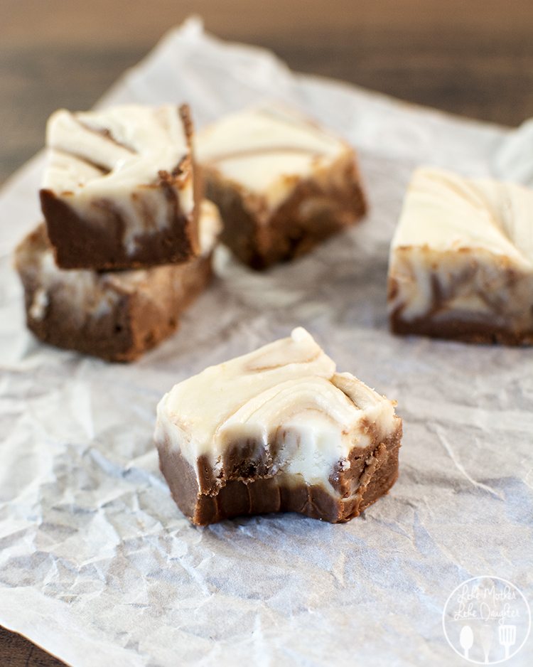 Angled view of swirled fudge on parchment paper.