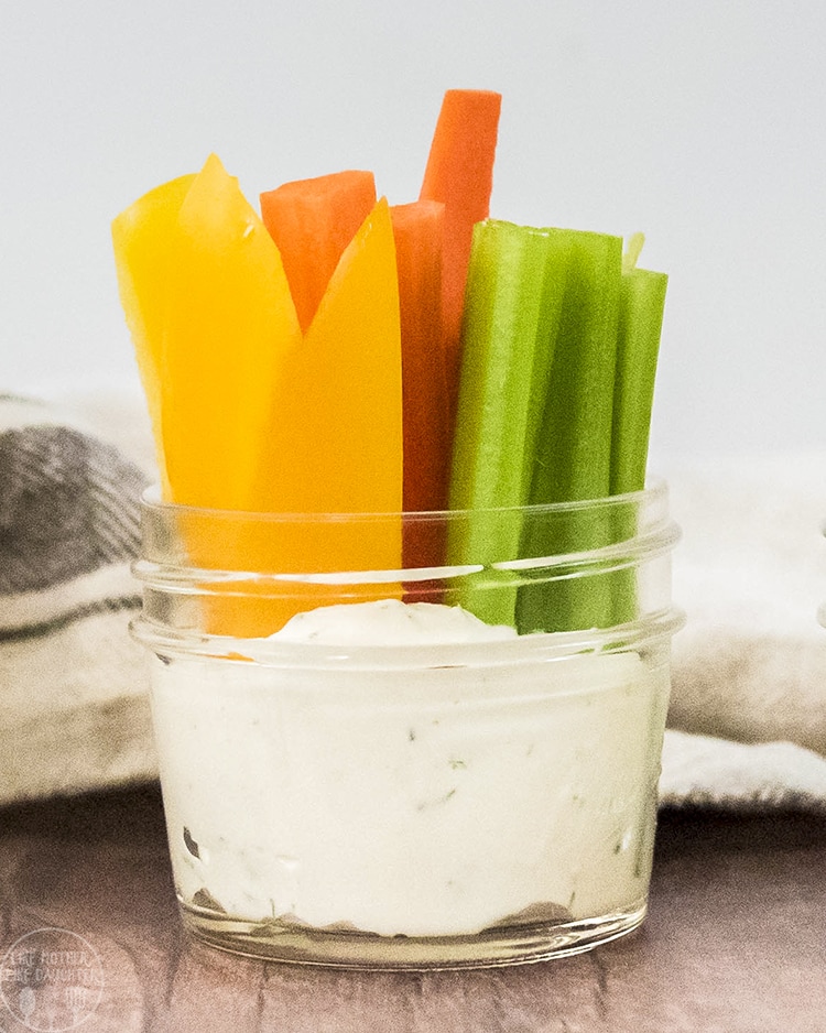 Close up shot of vegetables cut sitting in a bowl with ranch dip.