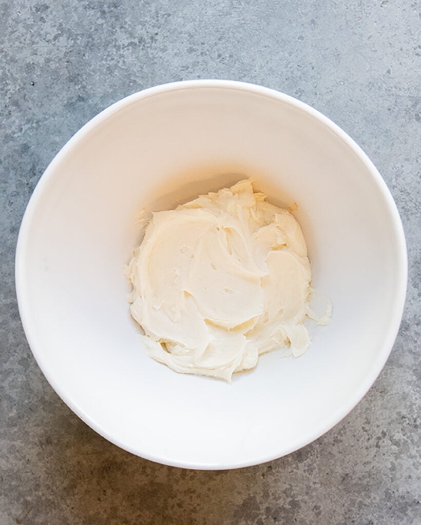 An above photo of smooth cream cheese.