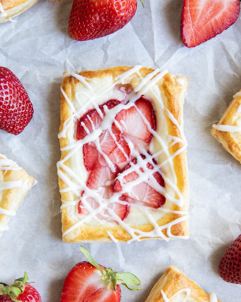 An above view of a strawberry and cream cheese pastry.