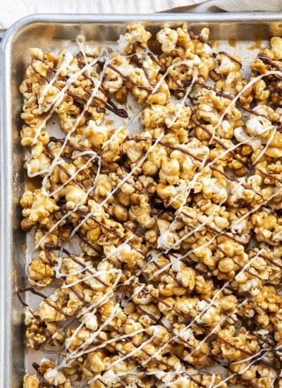 Zebra caramel popcorn on a baking pan.
