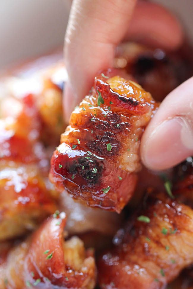 Close up of a food wrapped in bacon.