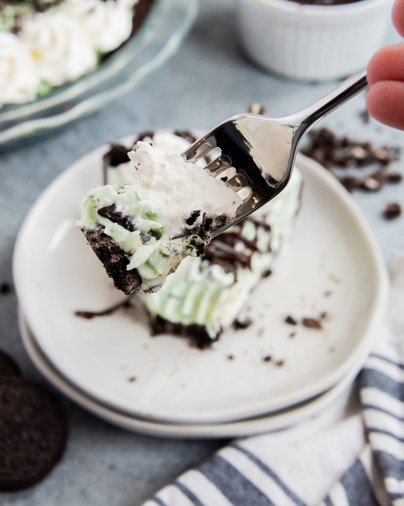 A forkful of mint ice cream pie.