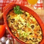 Baked omelette in a red baking pan.