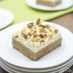 Close up of carrot cake cookie bar on a white plate.