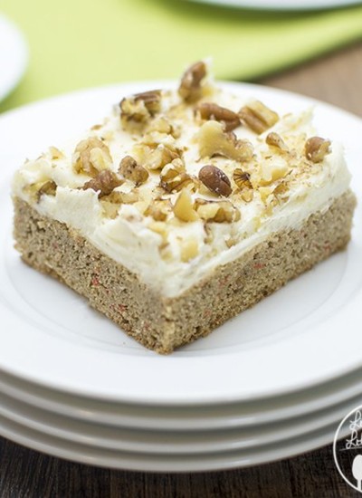 Close up of carrot cake cookie bar on a white plate.