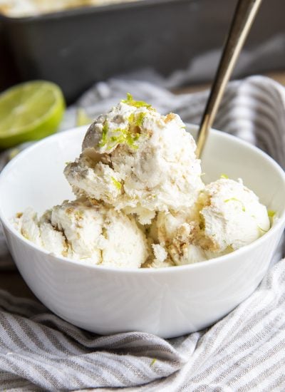 A bowl of key lime ice cream topped with lime zest.